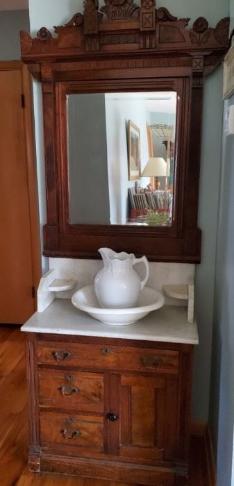 Antique Victorian walnut and marble washstand                     Contact Anita 816-262-5305