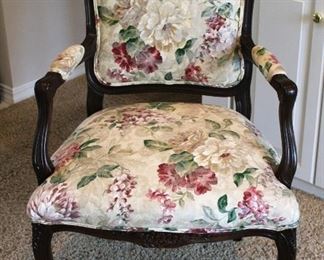 Beautifully styled armchair with upholstered floral motif.