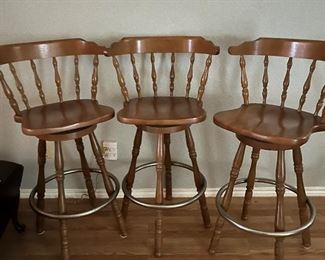 three vintage bar stools