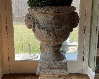 Pair of Cast Concert Vintage Plinth & Urns with Faux Boxwood Topiary. Each Measures 55" H x 30". Photo 1 of 4.