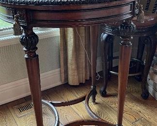 Maitland-Smith Marble Top Bistro Table with Gold Tassel Trim. Measures 34" D x 42" H. Photo 1 of 2.