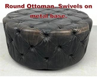 Lot 620 Large Tufted Leather Round Ottoman. Swivels on metal base. 