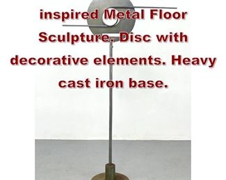 Lot 634 Tall Art Deco inspired Metal Floor Sculpture. Disc with decorative elements. Heavy cast iron base. 