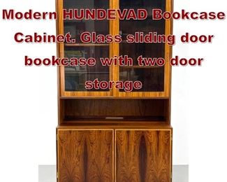 Lot 635 Rosewood Danish Modern HUNDEVAD Bookcase Cabinet. Glass sliding door bookcase with two door storage 