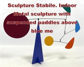 Lot 641 Colorful Kinetic Wind Sculpture Stabile. Indoor Metal sculpture with suspended paddles above blue me