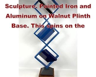 Lot 730 Roger Phillips Kinetic Sculpture. Painted Iron and Aluminum on Walnut Plinth Base. This spins on the