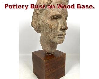 Lot 786 Modernist Style Pottery Bust on Wood Base.