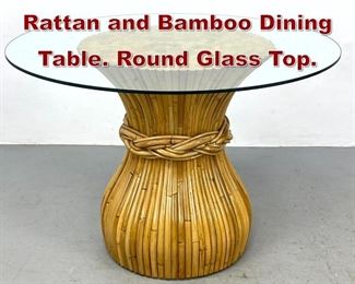 Lot 873 Corseted Banded Rattan and Bamboo Dining Table. Round Glass Top. 