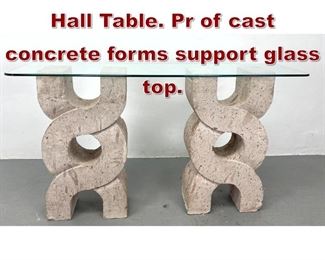 Lot 882 Modernist Console Hall Table. Pr of cast concrete forms support glass top. 