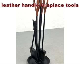 Lot 927 Jacques Adnet style leather handle fireplace tools