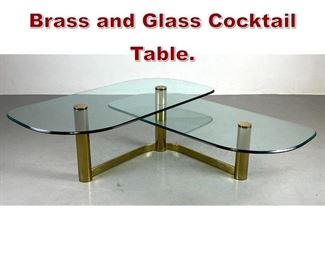 Lot 1034 Modernist BiLevel Brass and Glass Cocktail Table. 
