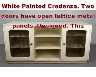 Lot 1053 Parzinger Modernist White Painted Credenza. Two doors have open lattice metal panels. Unsigned. This
