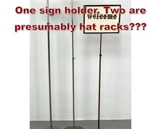 Lot 1072 Lot Tall Metal Poles. One sign holder. Two are presumably hat racks