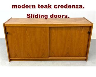 Lot 1091 Vintage Danish modern teak credenza. Sliding doors. 