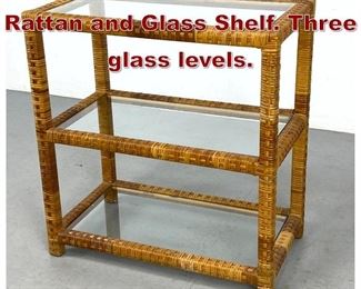 Lot 1117 Small Modernist Rattan and Glass Shelf. Three glass levels. 
