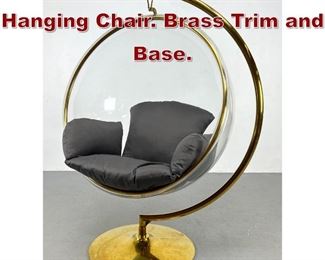 Lot 1126 Lucite Bubble Hanging Chair. Brass Trim and Base. 
