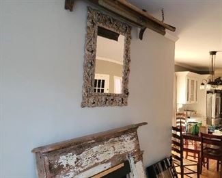 Chippy mantle, mirror and the lid to a cotton gin hanging to create an awning effect