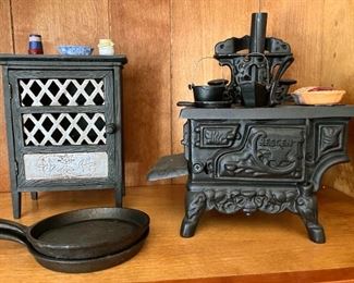 Cast mini iron pie safe with pies and accessories, Small egg cast iron pans (2), Vintage mini "rescent" cast iron stove with kettle, pots, pans