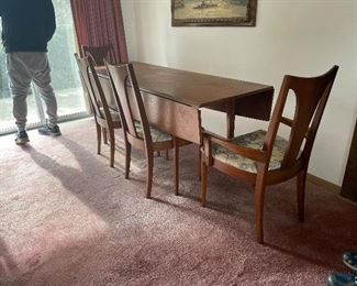 mid century modern dropleaf narrow dinette set. Great for a narrow dining area 6 chairs total.broyhill sculptra line 