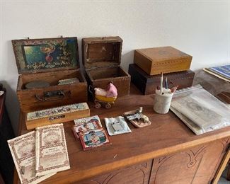 vintage antique deco boxes a few baseball cards vintage brochures . small metal toy buggy