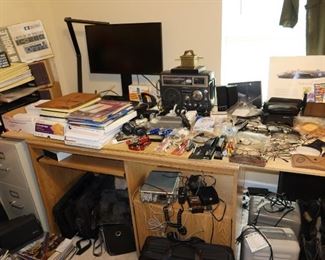Office Desk full of Glasses and Office Supplies