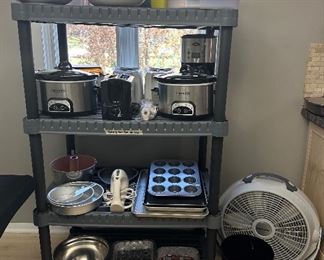 Crock Pots; Oster Coffee Pot; Toastmaster & B&D Toasters; Electric Knife; Hamilton Beach Hand Mixer; Baking Pans; Wind Master Fan; Containers