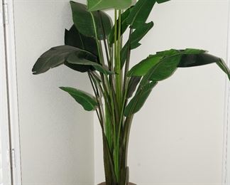 Faux palm in stone planter