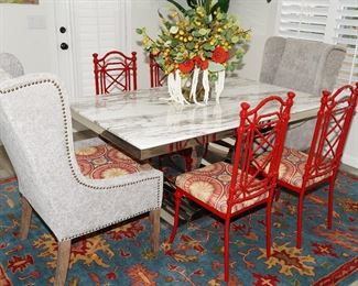 Custom covered wrought iron and upholstered chairs with a granite topped chrome dining table-Table and chairs sold separately.