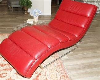 Mid century red leather lounge chair on chrome base