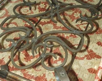 Forged iron glass coffee table in the manner of Gilbert Poillerat