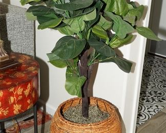 Faux plant in rattan planter