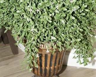 Topiary in golden pedestal planter