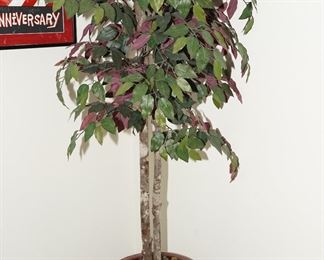 Faux plant in glazed burgundy planter