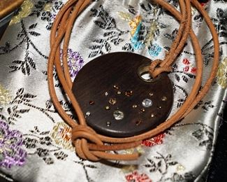 Onyx gemstone pendant with leather wrap