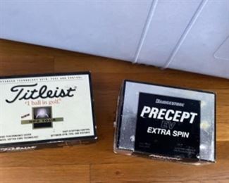 Over 50 boxes of golf balls for sale