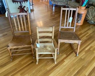 Late 1800's rocking chairs with hide seat and original cane.