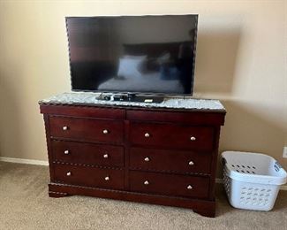 Dresser and 42 in TV