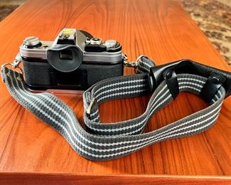 Canon AE-1 35mm Camera with FD 50mm 1.4 Lens		
