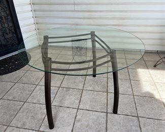 Glass Top Black Frame Table	49.5 x 48in diameter.	
	
