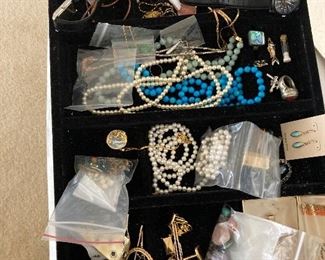 some jewelry --two strands of pearls