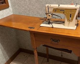 Sewing machine and table
