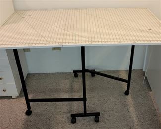 Portable folding crafting/sewing table