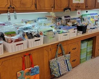 Quilting fabric, sewing supplies, knitting needles, scissors and more!