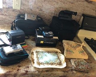 Canon ZR10 Camcorder, Sony Handycam, Polaroid 660 Camera, Nikon Coolpix S550 Camera