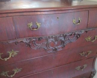 carvings on antique dresser