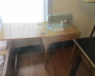 sewing machine in cabinet
