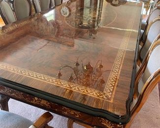 The MOST amazing dining table, chairs, curio cabinet and buffet we've seen!  Inlaid and purchased in Sorrento, Italy and shipped to the owner's home.  12 chairs!  