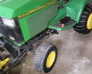 425 John deere with 640 hrs. Snowblower, loader, mower deck, suitcase weights,  wheel weights and tire chains.