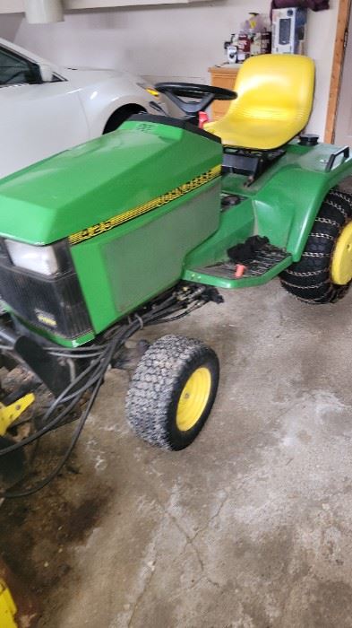 425 John deere with 640 hrs. Snowblower, loader, mower deck, suitcase weights, wheel weights and tire chains.