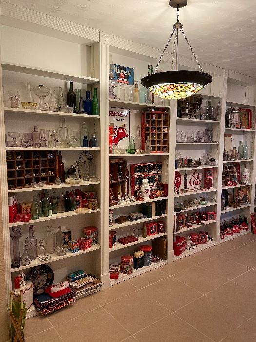 Entire Wall of Coca-Cola Collectibles as well as antique Sun Purple Glass and Bottles. 